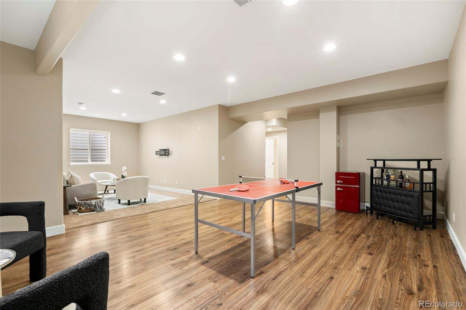 10415 Startrail Court Highlands Ranch, CO 80126 - Photo 38 of 49 a living room with furniture and wooden floor
