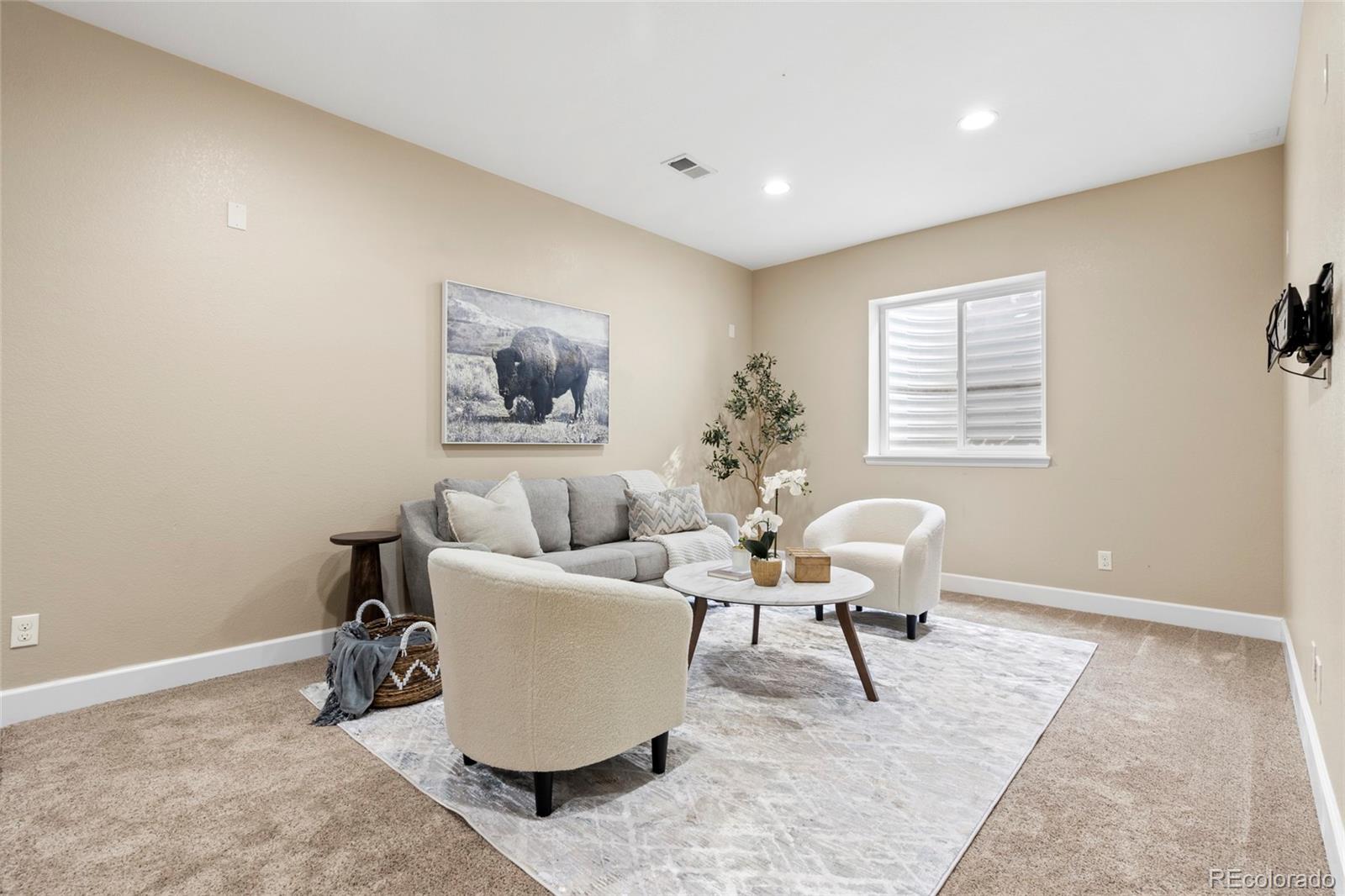 10415 Startrail Court Highlands Ranch, CO 80126 - Photo 39 of 49 a living room with furniture and a window
