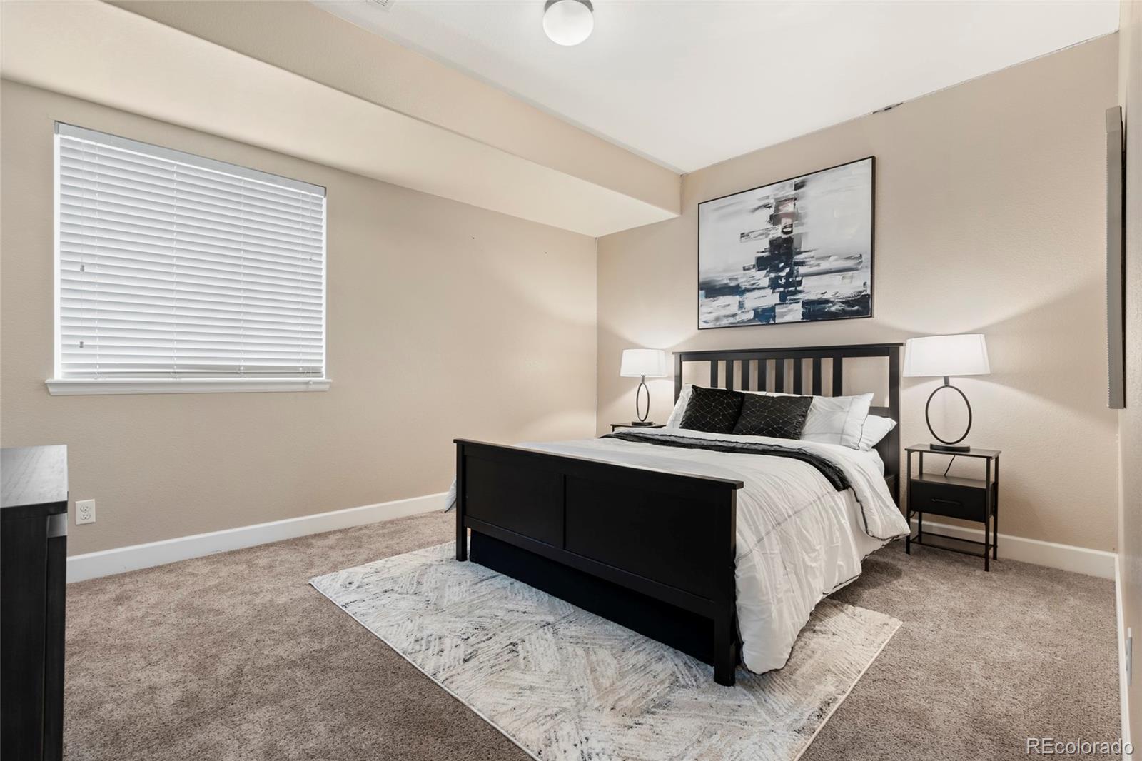 10415 Startrail Court Highlands Ranch, CO 80126 - Photo 40 of 49 a bedroom with a bed and a window