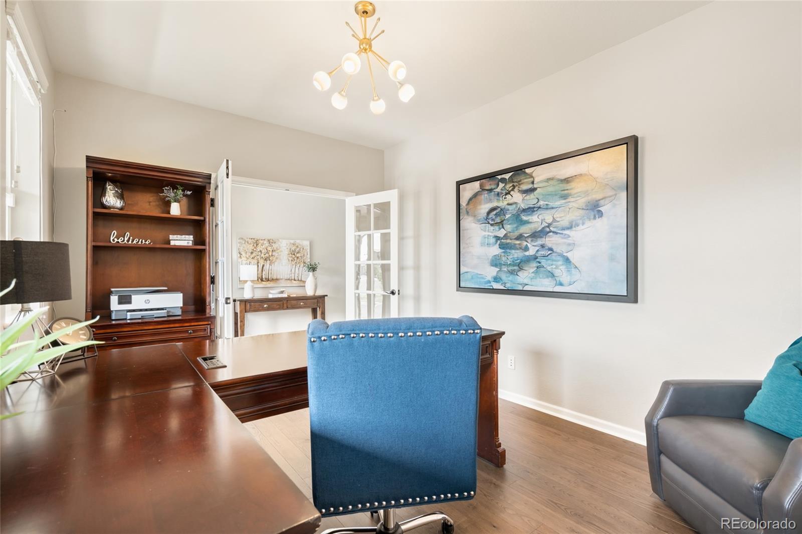 10415 Startrail Court Highlands Ranch, CO 80126 - Photo 6 of 49 a living room with furniture and a large window