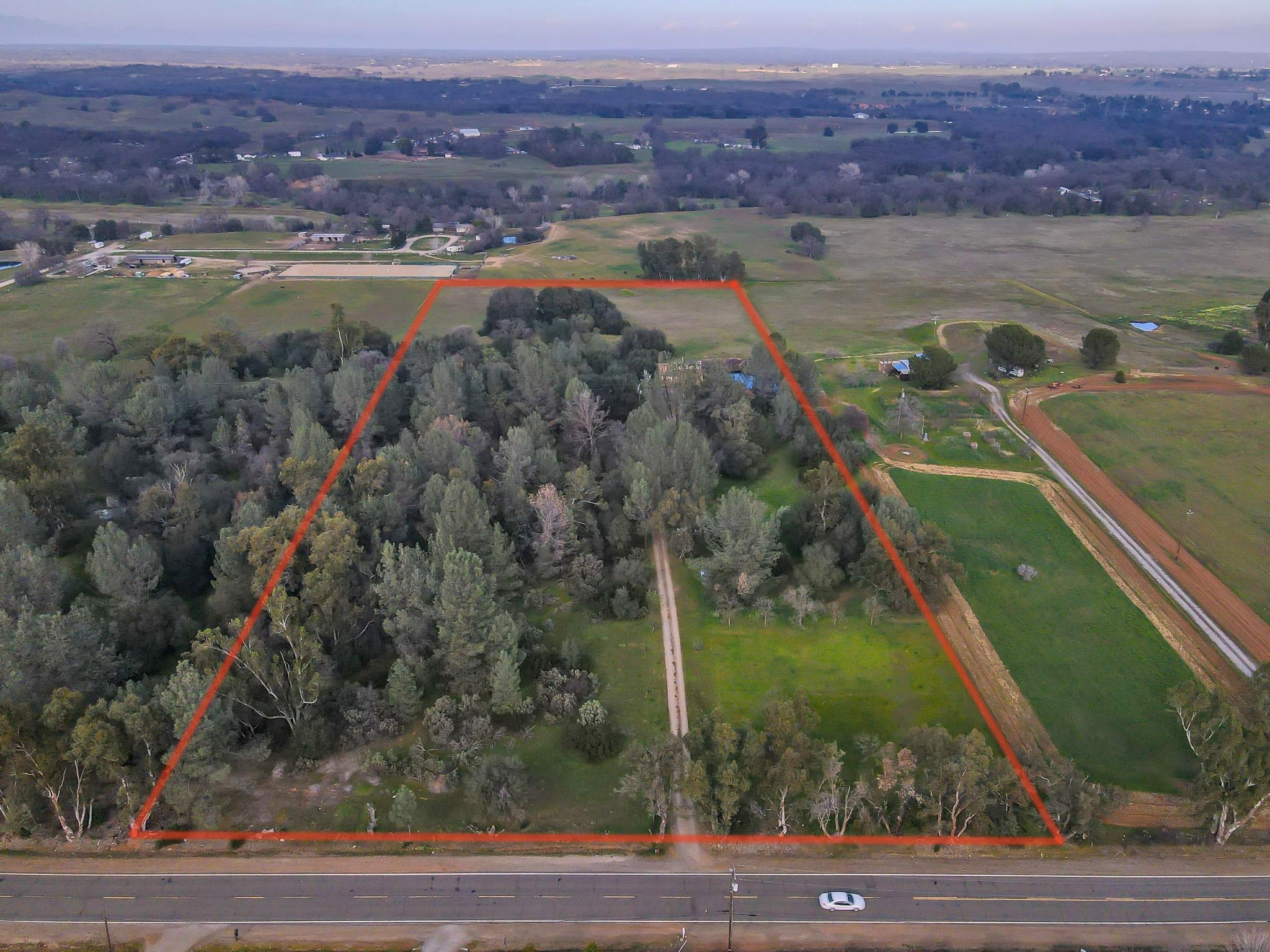 19980 Live Oak Road Red Bluff, CA 96080 - Photo 35 of 36 an aerial view of residential houses with outdoor space and river
