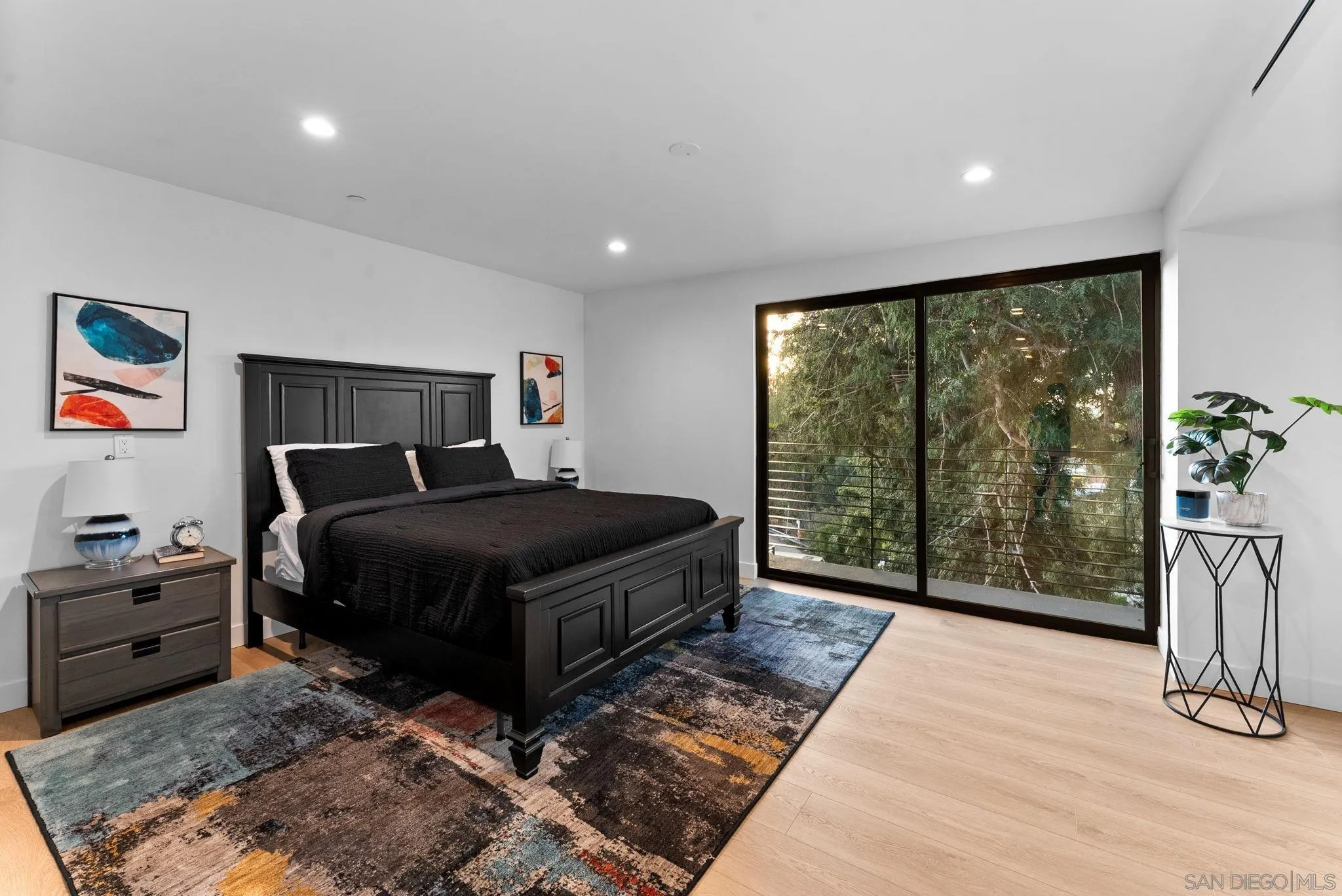 3653 Wilson Avenue San Diego, CA 92104 - Photo 18 of 60 a bedroom with a bed and glass window