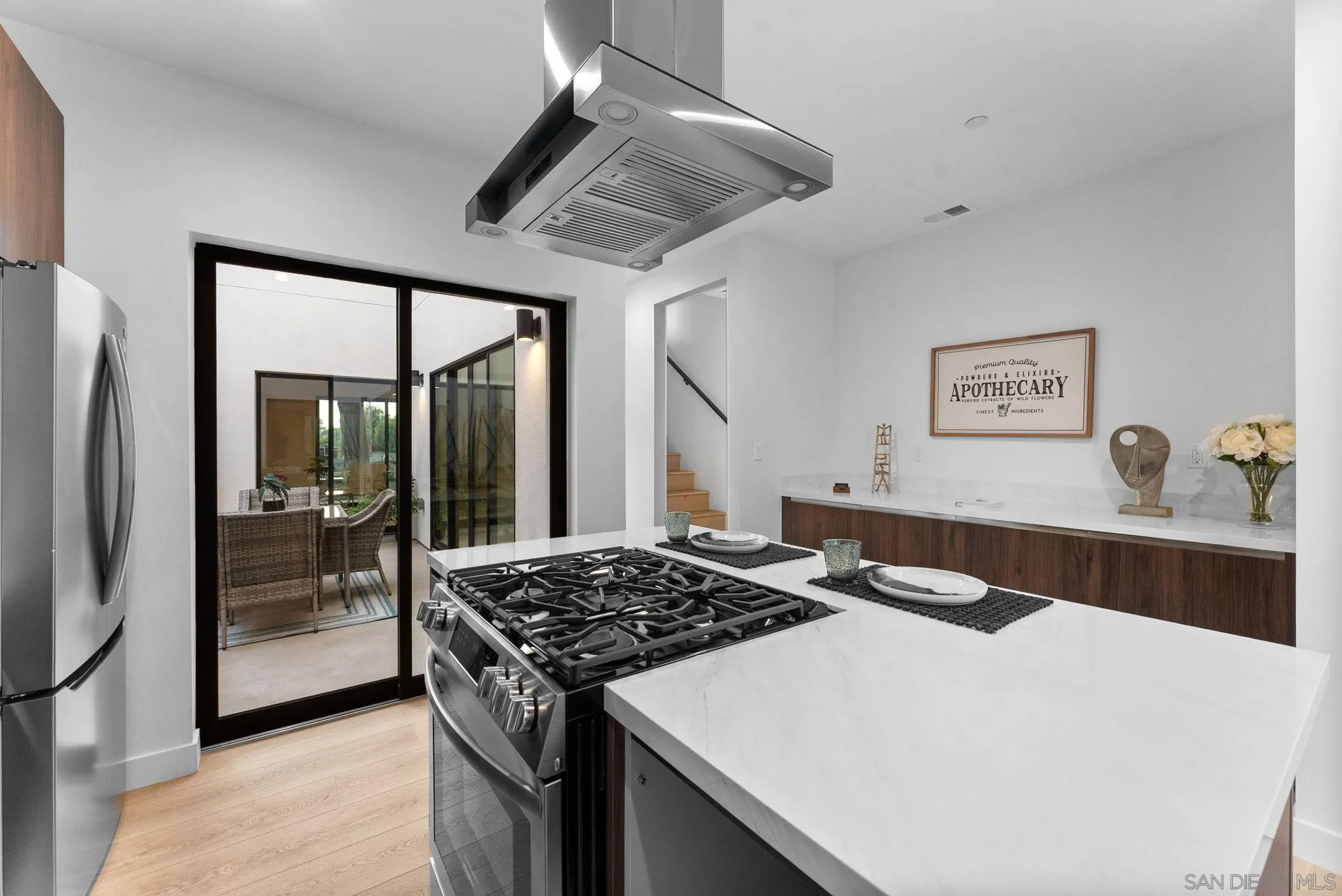 3653 Wilson Avenue San Diego, CA 92104 - Photo 2 of 60 a kitchen with stainless steel appliances granite countertop a sink stove and refrigerator