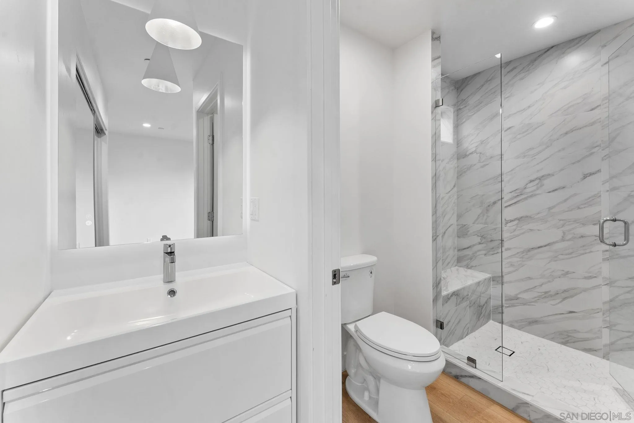 3653 Wilson Avenue San Diego, CA 92104 - Photo 27 of 60 a bathroom with a sink toilet and shower