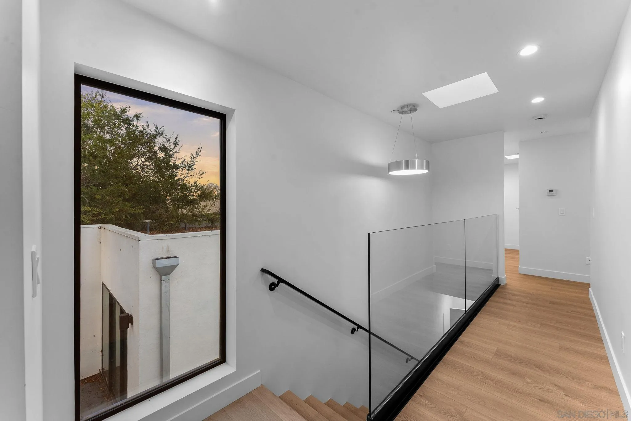 3653 Wilson Avenue San Diego, CA 92104 - Photo 35 of 60 a view of a hallway with windows and entryway