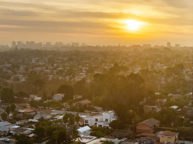 a view of kitchen with refrigerator and window