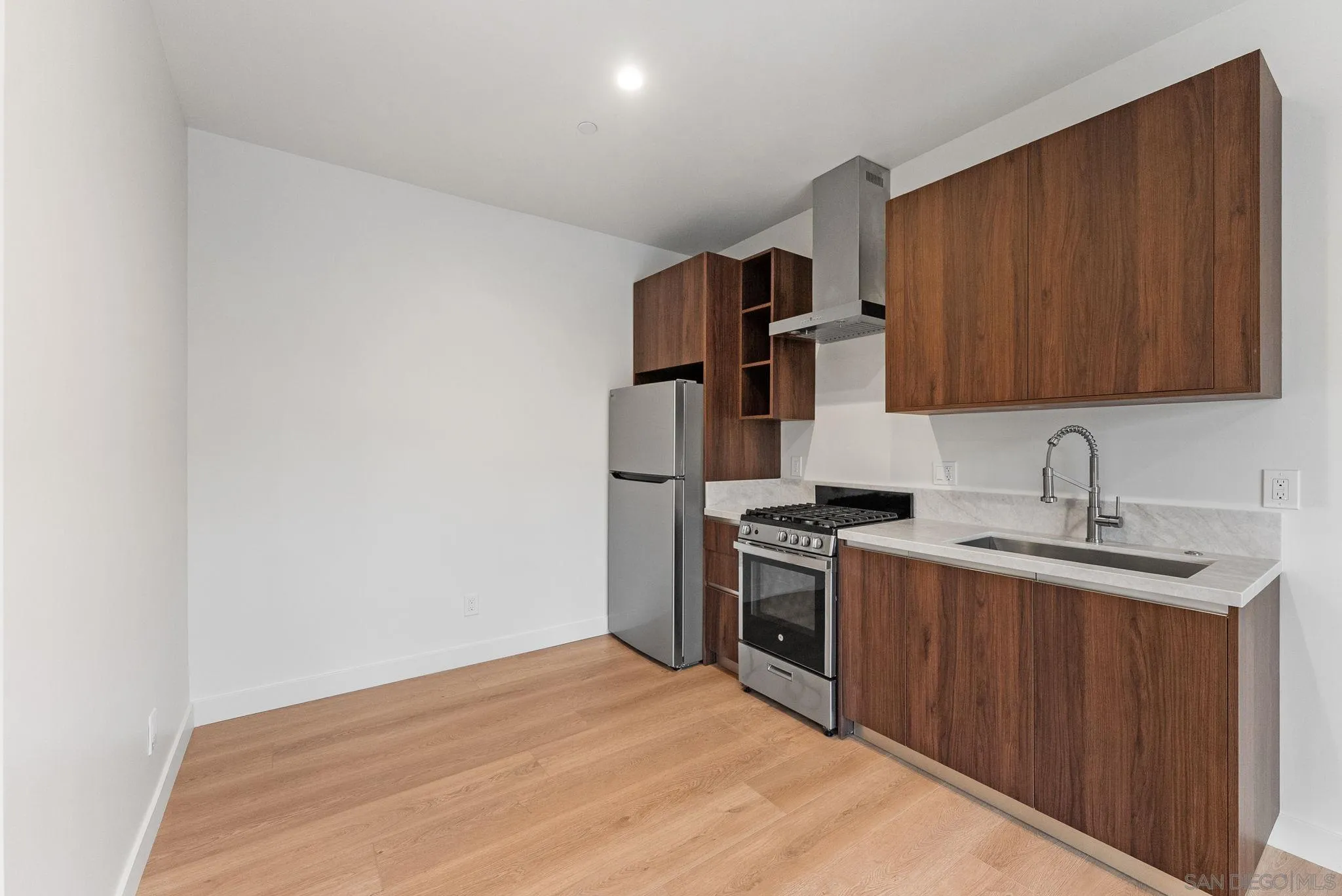 3653 Wilson Avenue San Diego, CA 92104 - Photo 54 of 60 a kitchen with stainless steel appliances granite countertop a sink stove and refrigerator