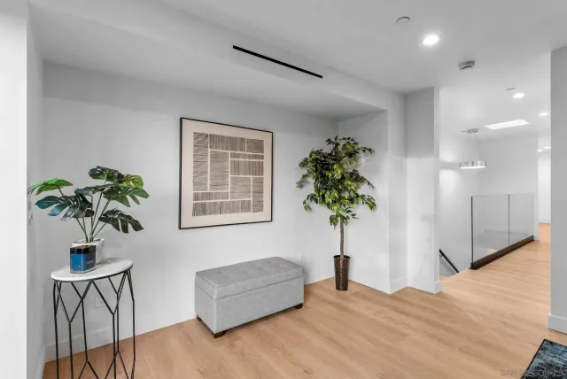 a view of living room filled with furniture and a potted plant