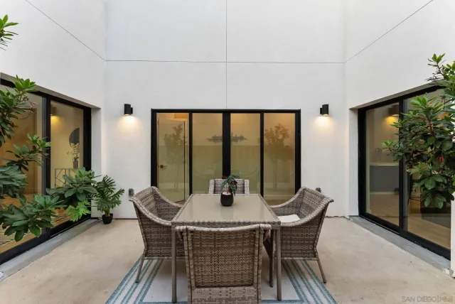 a dining room with furniture and window