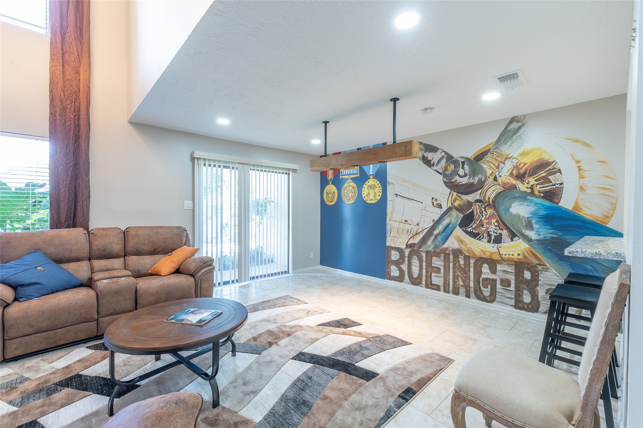 38 Regency Point Montgomery, TX 77356 - Photo 7 of 49 family room, front door in the middle, mural on the right