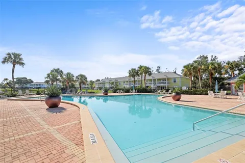 a view of a house with yard and sitting area