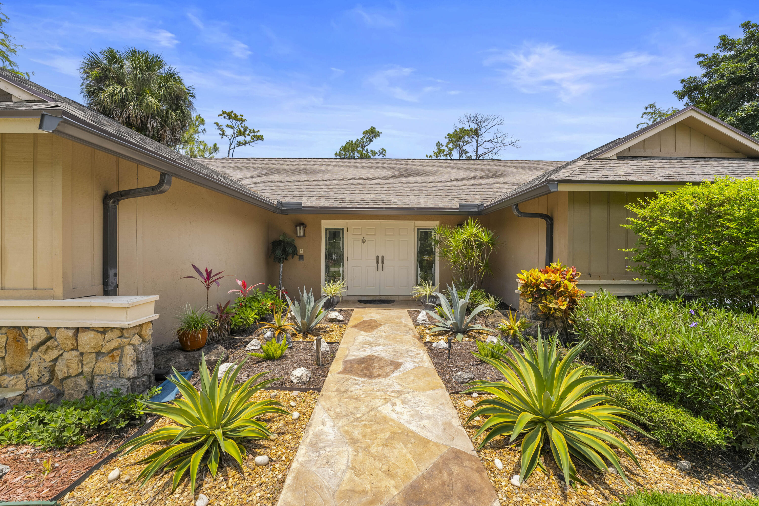 196 Scarborough Terrace Wellington, FL 33414 - Photo 1 of 33 a view of a house with potted plants