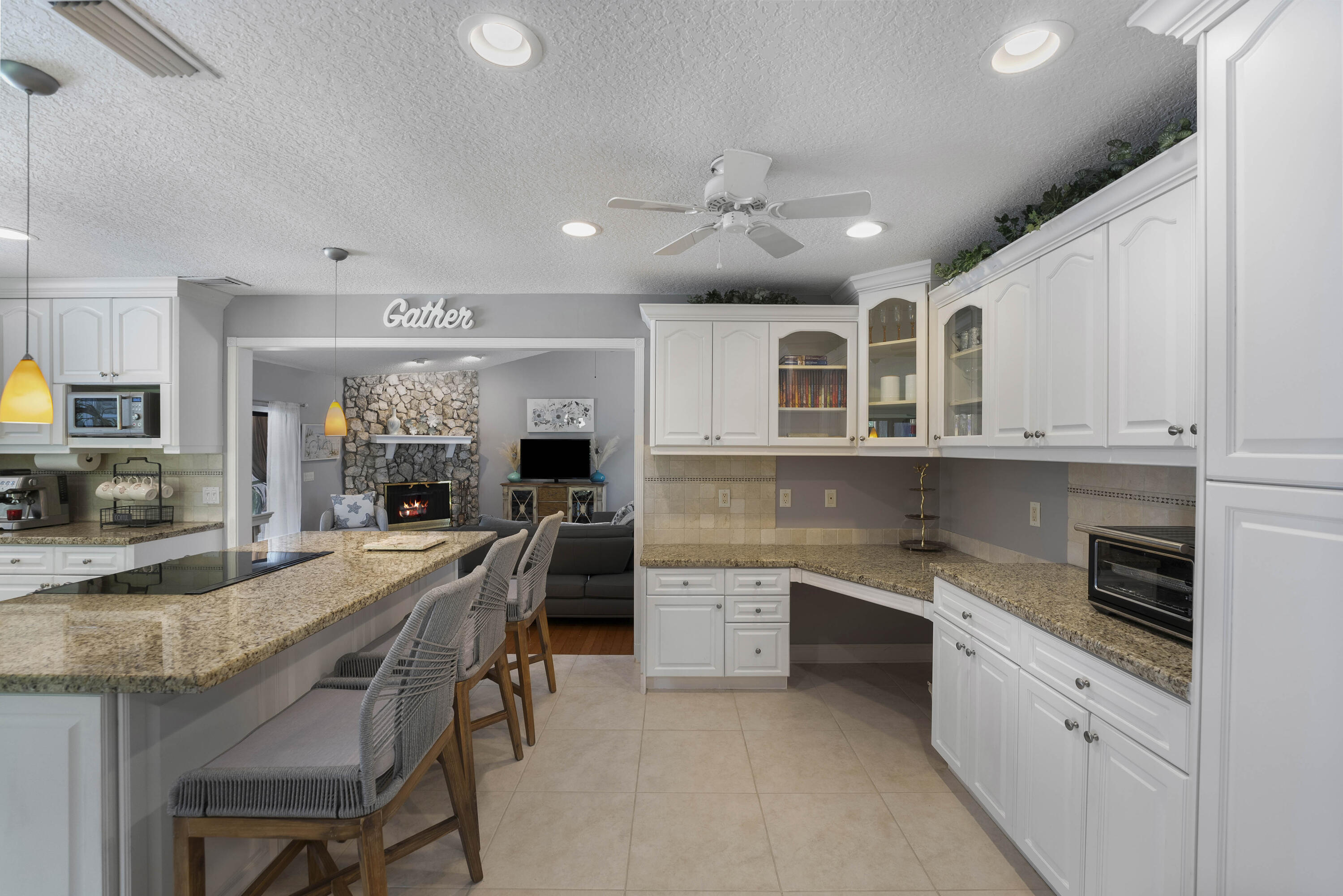 196 Scarborough Terrace Wellington, FL 33414 - Photo 12 of 33 a large kitchen with granite countertop lots of counter space and window