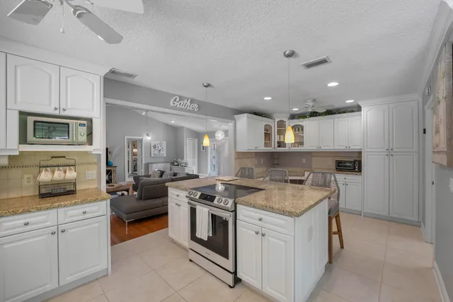 a kitchen with a stove and a refrigerator