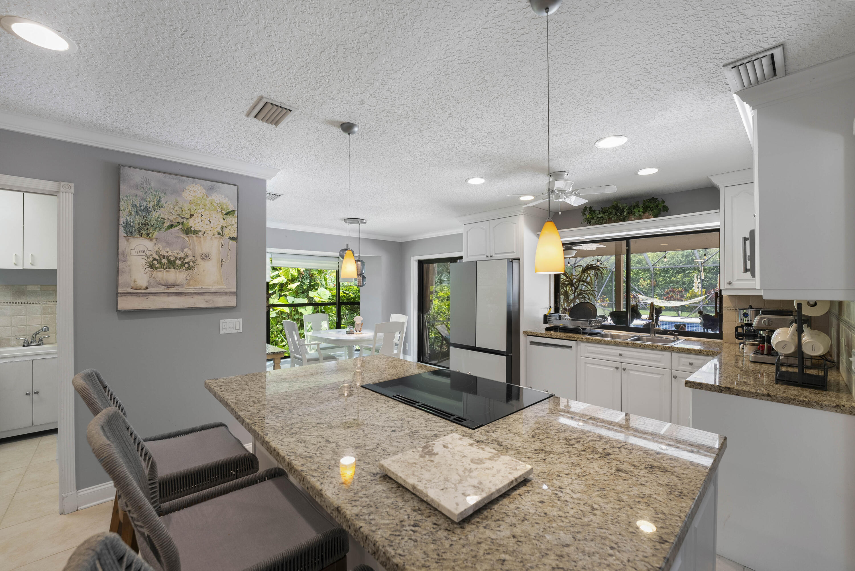 196 Scarborough Terrace Wellington, FL 33414 - Photo 16 of 33 a kitchen with sink and view of living room