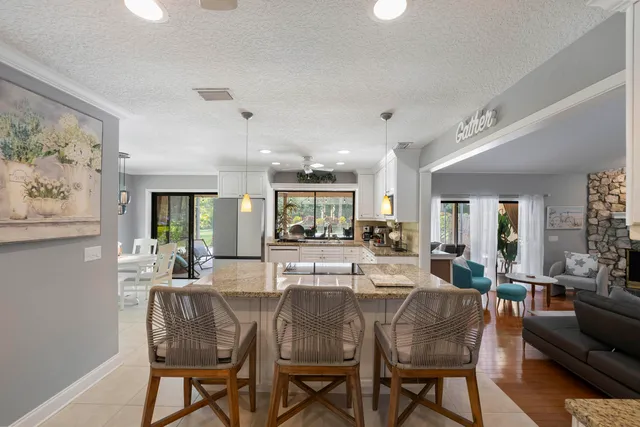 a view of a dining room with furniture window and outside view