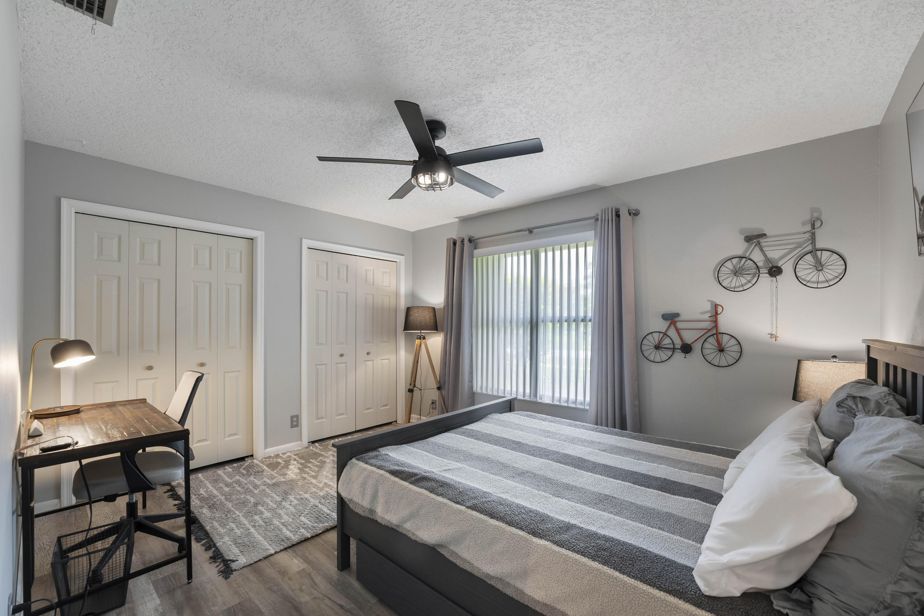 196 Scarborough Terrace Wellington, FL 33414 - Photo 21 of 33 a bedroom with a bed and a chandelier