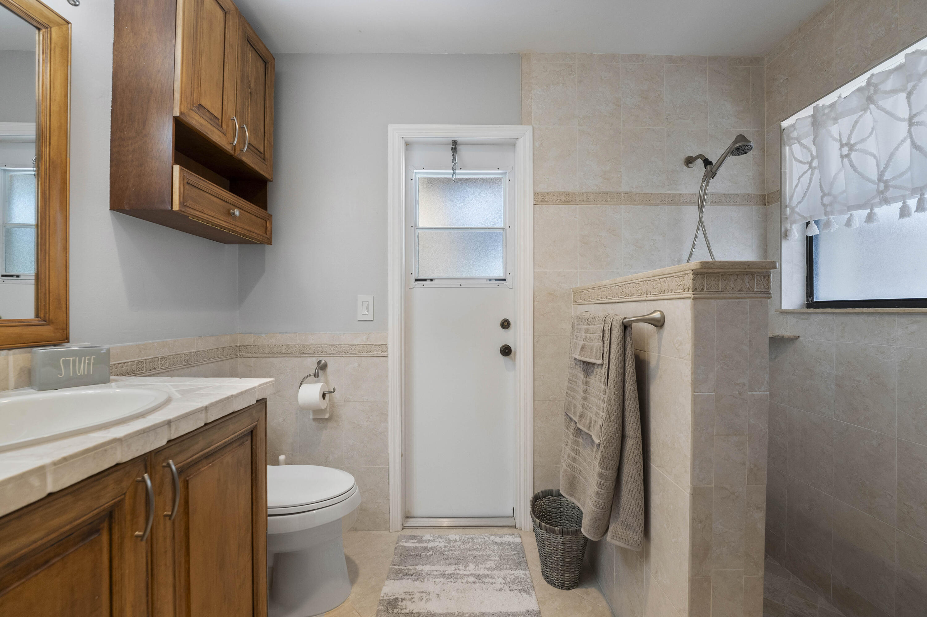 196 Scarborough Terrace Wellington, FL 33414 - Photo 26 of 33 a bathroom with a granite countertop toilet sink and shower