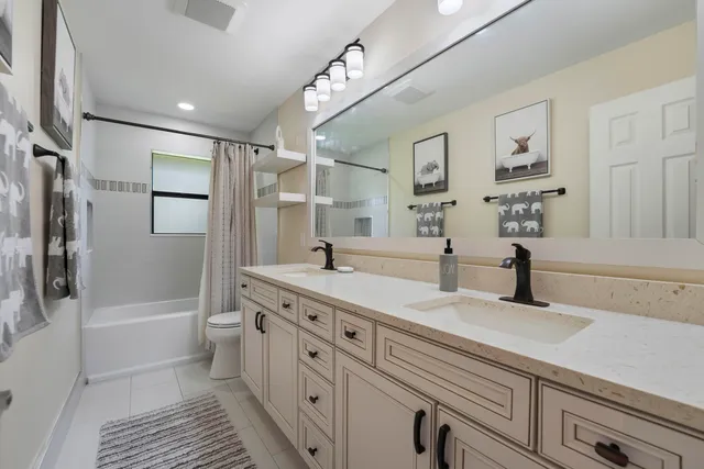 a utility room with sink dryer and washer