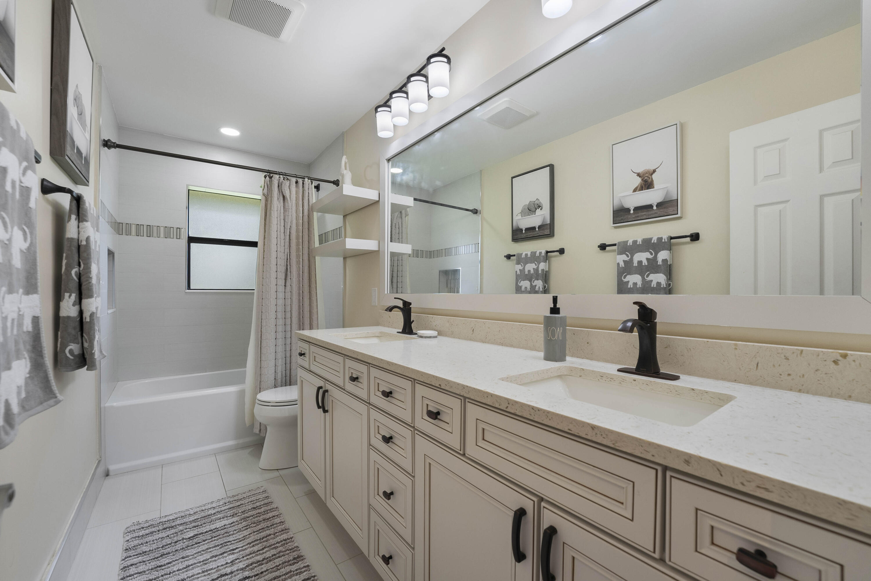 196 Scarborough Terrace Wellington, FL 33414 - Photo 27 of 33 a bathroom with a sink a toilet and shower