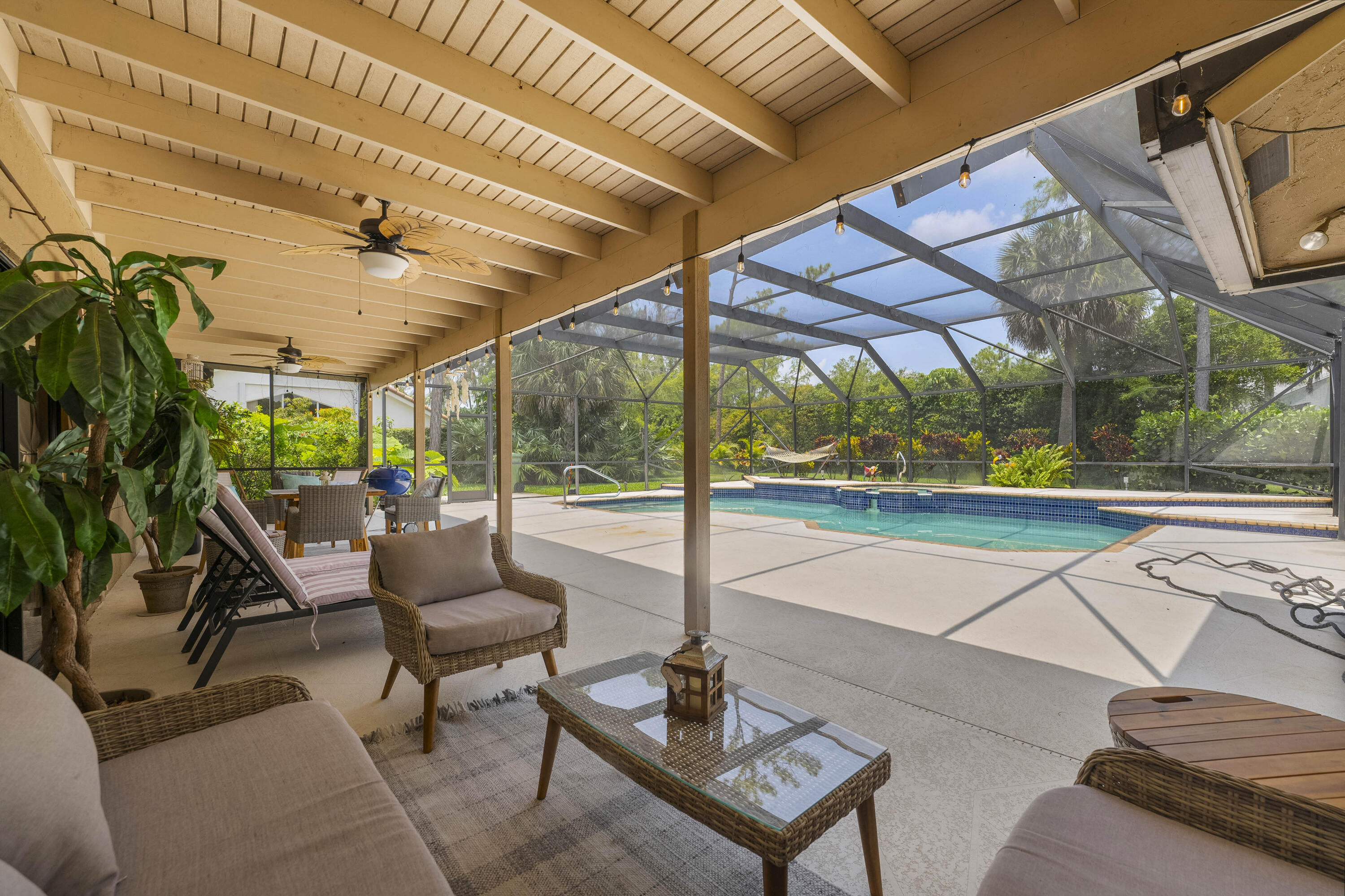196 Scarborough Terrace Wellington, FL 33414 - Photo 30 of 33 a building outdoor space with patio furniture and potted plants