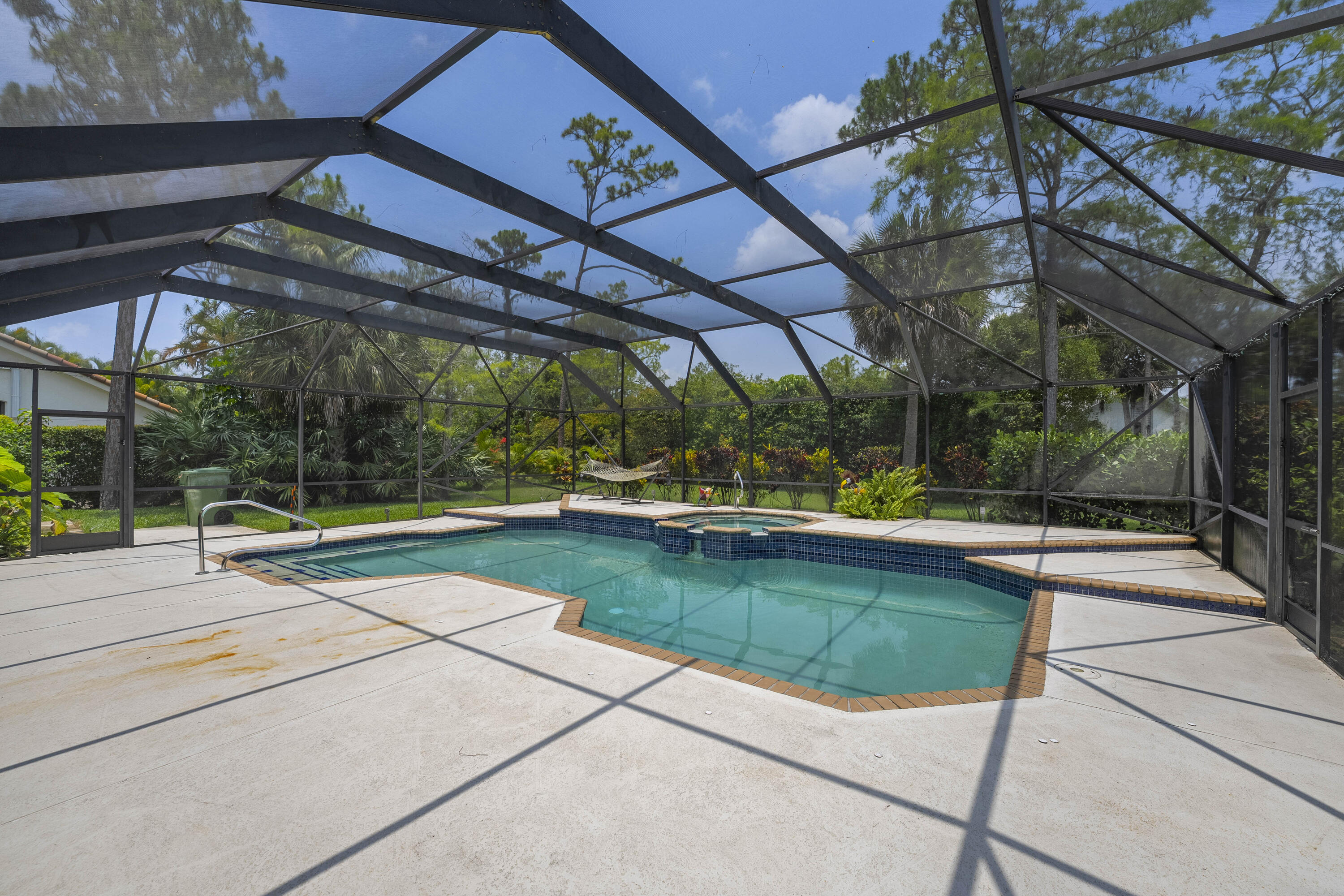 196 Scarborough Terrace Wellington, FL 33414 - Photo 31 of 33 a view of a swimming pool with a patio