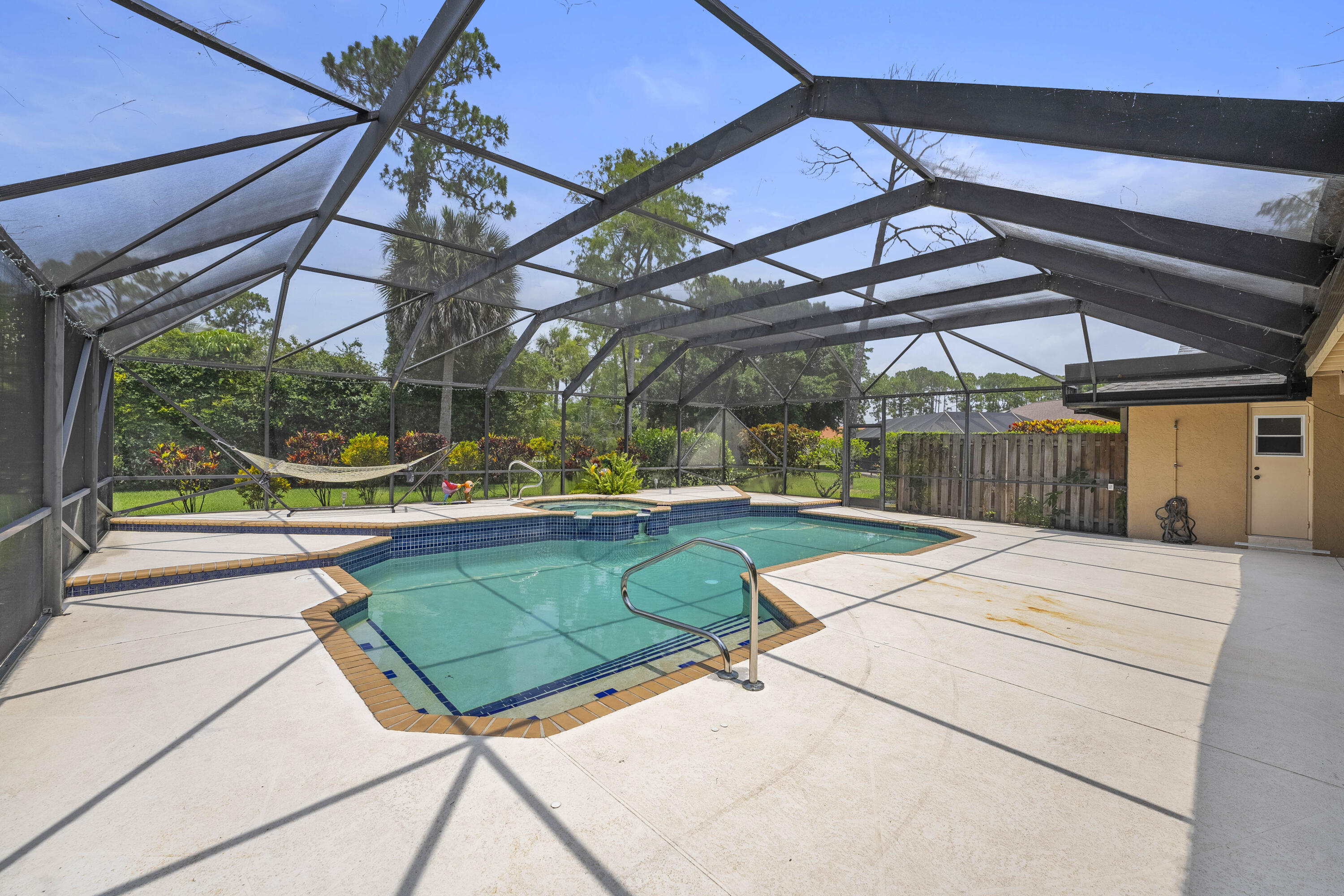 196 Scarborough Terrace Wellington, FL 33414 - Photo 33 of 33 a view of a backyard with a patio