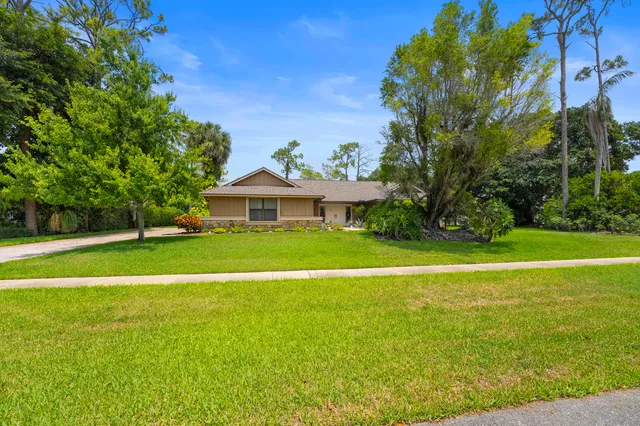 a view of a house with a big yard