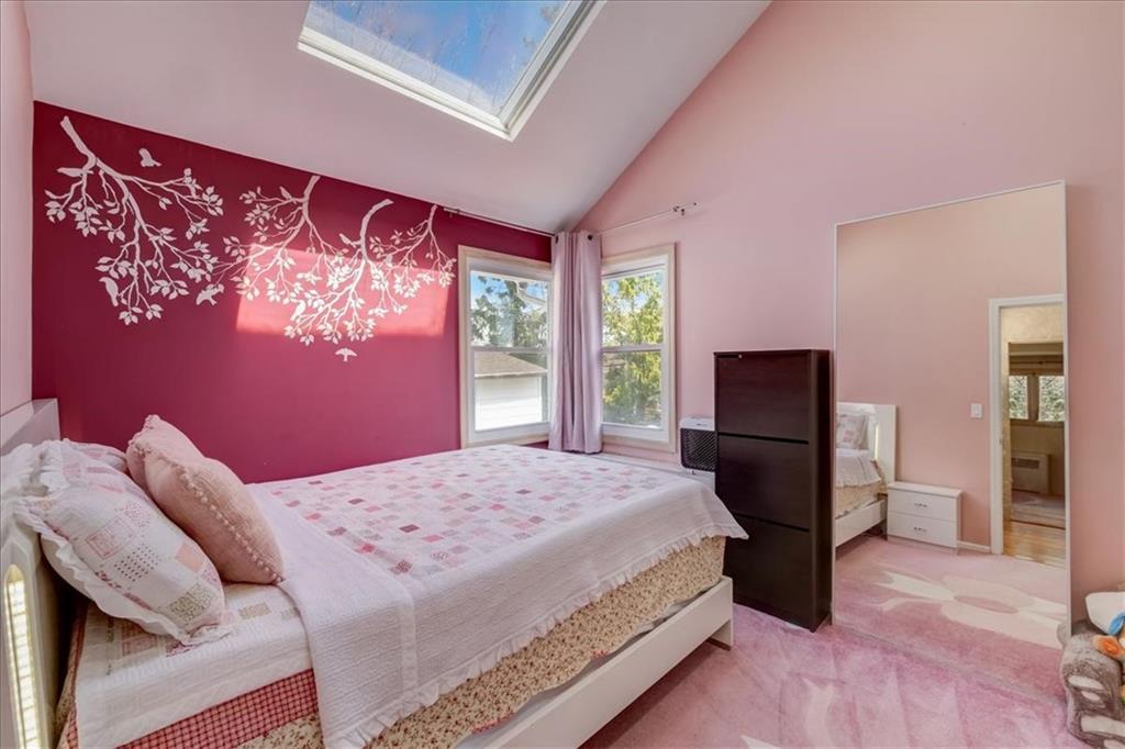 829 Bruce Drive East Meadow, NY 11554 - Photo 14 of 27 a bedroom with a bed and a flat screen tv