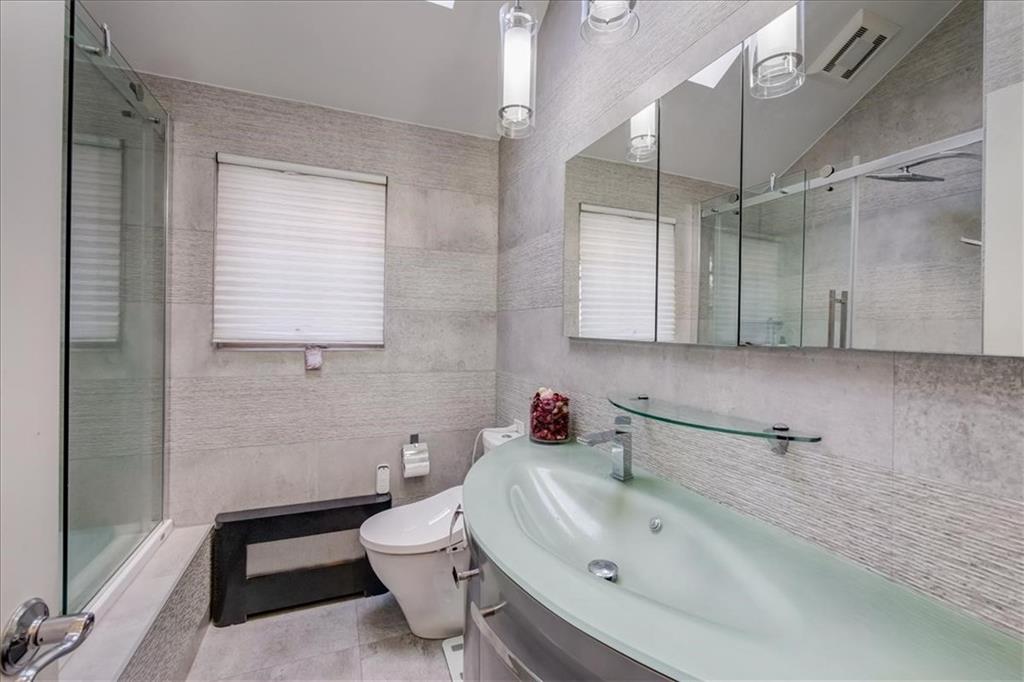 829 Bruce Drive East Meadow, NY 11554 - Photo 15 of 27 a bathroom with a sink toilet and shower