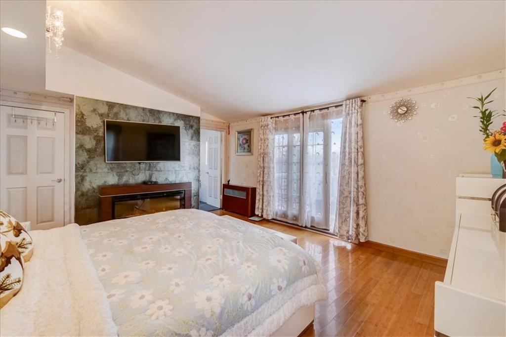 829 Bruce Drive East Meadow, NY 11554 - Photo 17 of 27 a view of livingroom with furniture and flat screen tv
