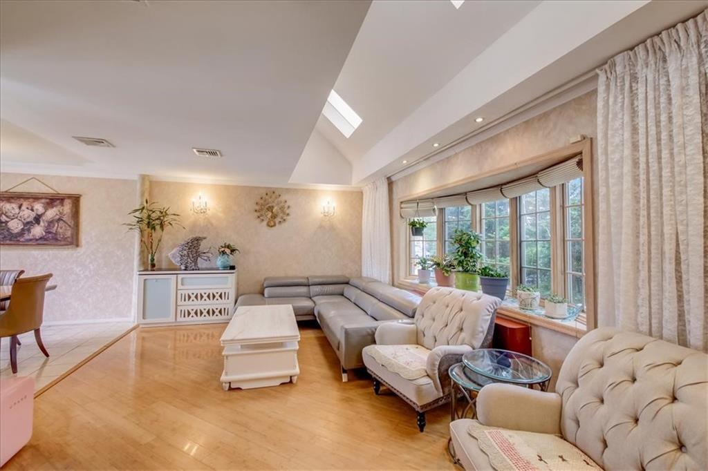 829 Bruce Drive East Meadow, NY 11554 - Photo 2 of 27 a living room with furniture and large windows