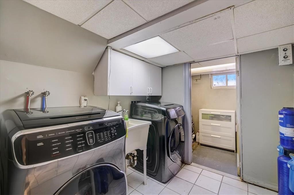 829 Bruce Drive East Meadow, NY 11554 - Photo 23 of 27 a utility room with dryer and washer