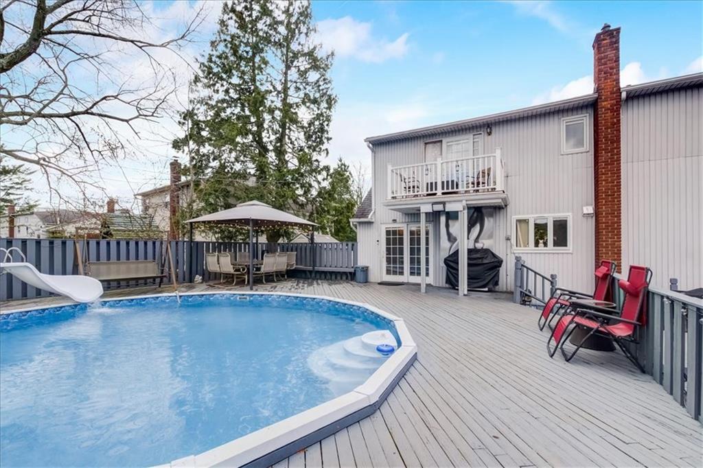 829 Bruce Drive East Meadow, NY 11554 - Photo 25 of 27 a view of a chairs and tables in the back yard of the house