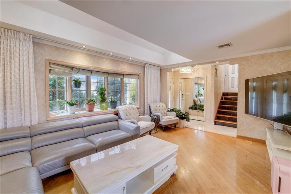 829 Bruce Drive East Meadow, NY 11554 - Photo 3 of 27 a living room with furniture and a large window