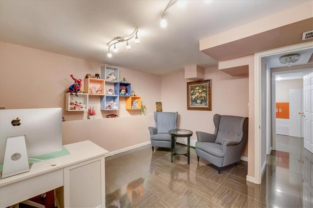 829 Bruce Drive East Meadow, NY 11554 - Photo 10 of 27 a living room with furniture and a table