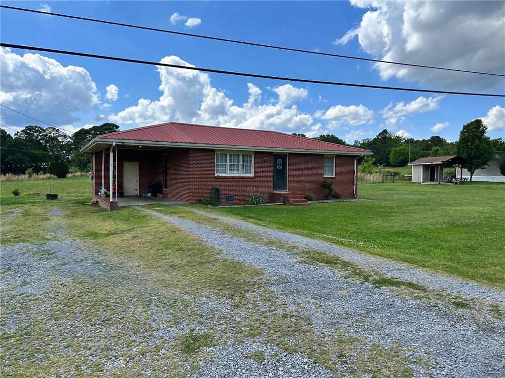 496 Martin Road Southwest Cartersville, GA 30120 - Photo 1 of 1 a view of a house with a yard