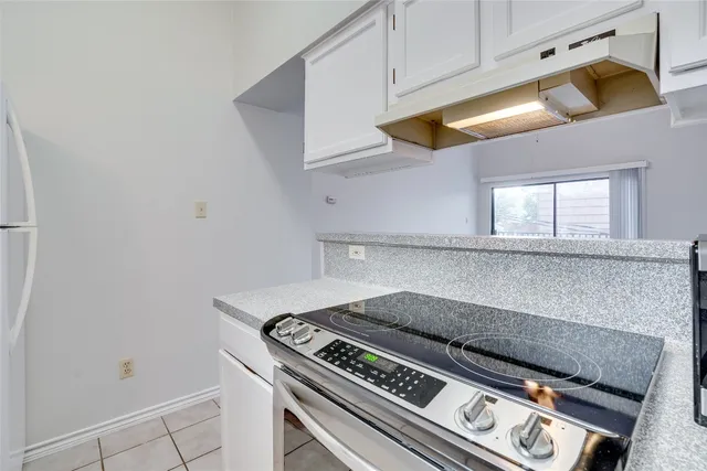 a kitchen with stainless steel appliances a refrigerator and a sink
