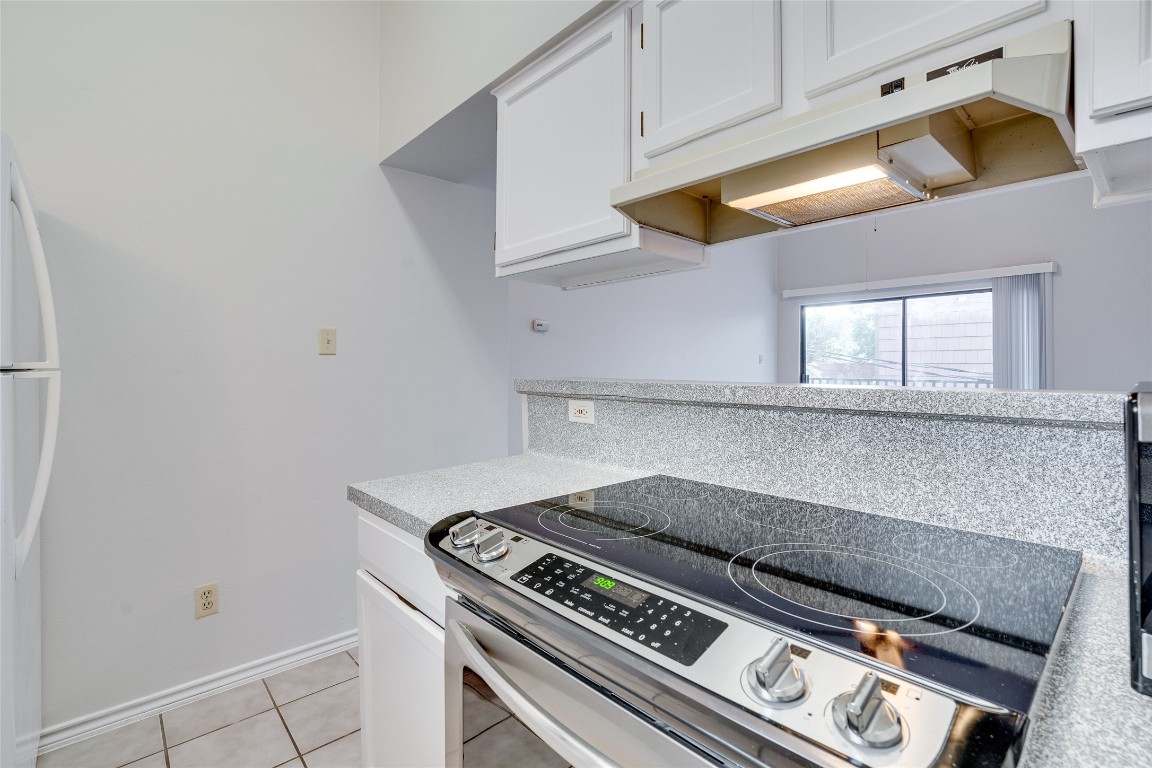 1908 San Antonio Street, Unit 306 Austin, TX 78705 - Photo 16 of 28 a stove top oven sitting inside of a kitchen