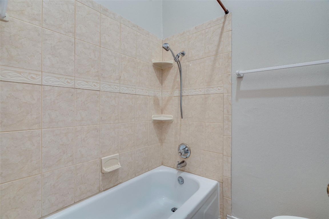 1908 San Antonio Street, Unit 306 Austin, TX 78705 - Photo 20 of 28 a bathroom with a bathtub and shower