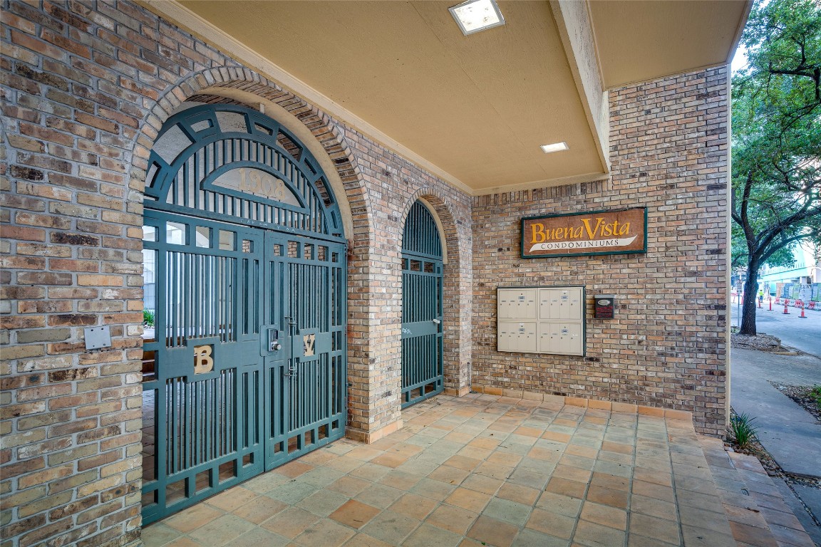 1908 San Antonio Street, Unit 306 Austin, TX 78705 - Photo 2 of 28 a view of a door with brick walls