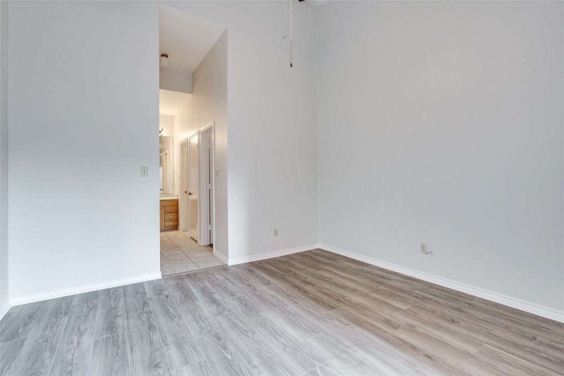 1908 San Antonio Street, Unit 306 Austin, TX 78705 - Photo 24 of 28 a view of empty room with wooden floor
