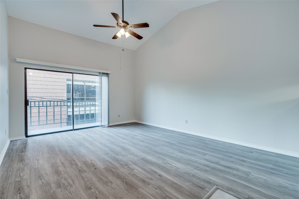 1908 San Antonio Street, Unit 306 Austin, TX 78705 - Photo 7 of 28 a view of an empty room with wooden floor and a window