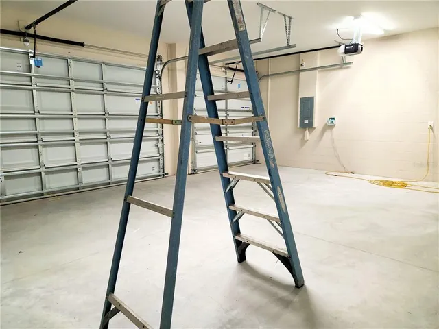 a view of a room with wooden floor and window