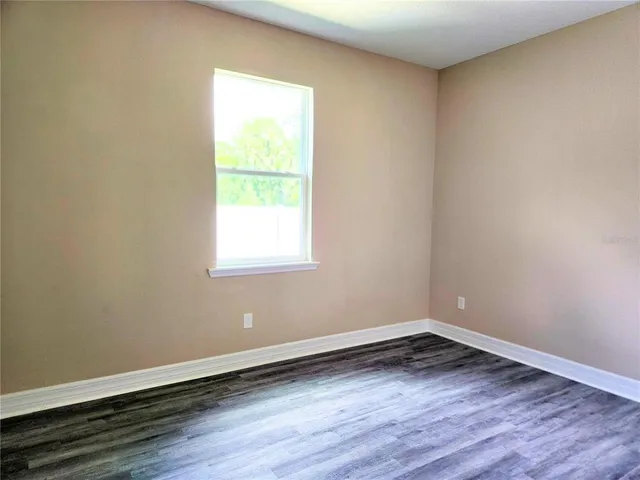 a view of outdoor space with deck and trees