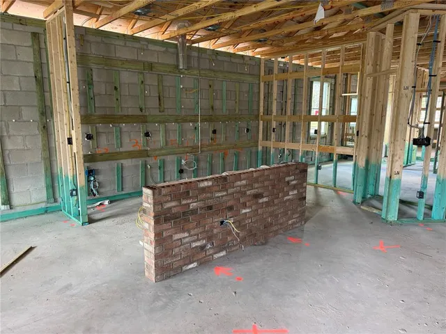 a front view of a house with yard and garage