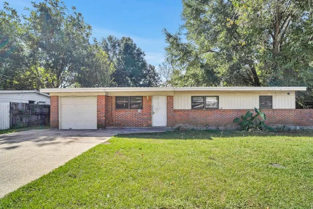 front view of a house and a yard
