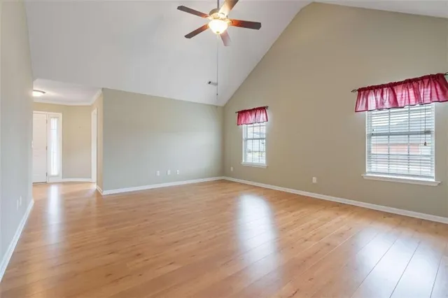 wooden floor in an empty room with a window