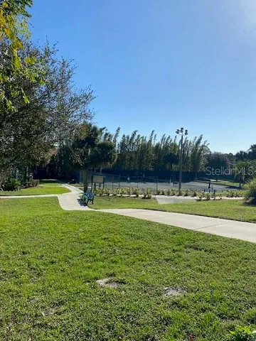a view of a swimming pool and a yard