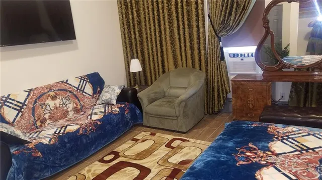 a living room with furniture and a rug